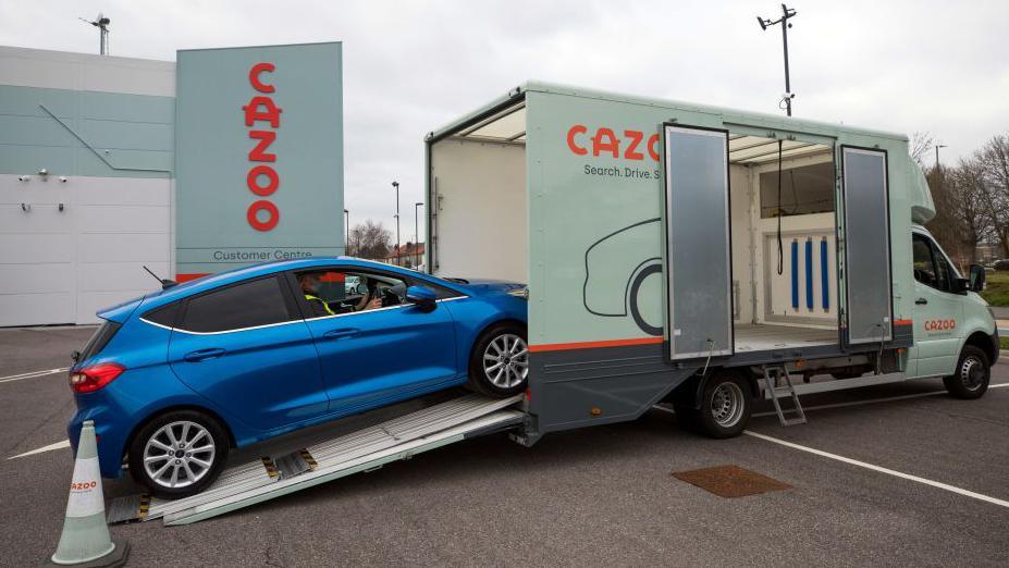 Car being loaded onto Cazoo van