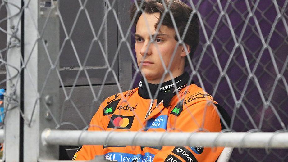 Oscar Piastri sat looking glum after crashing out of the Azerbaijan Grand Prix