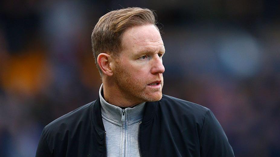 Gavin Cowan looks to his right during a match for Shrewsbury Town