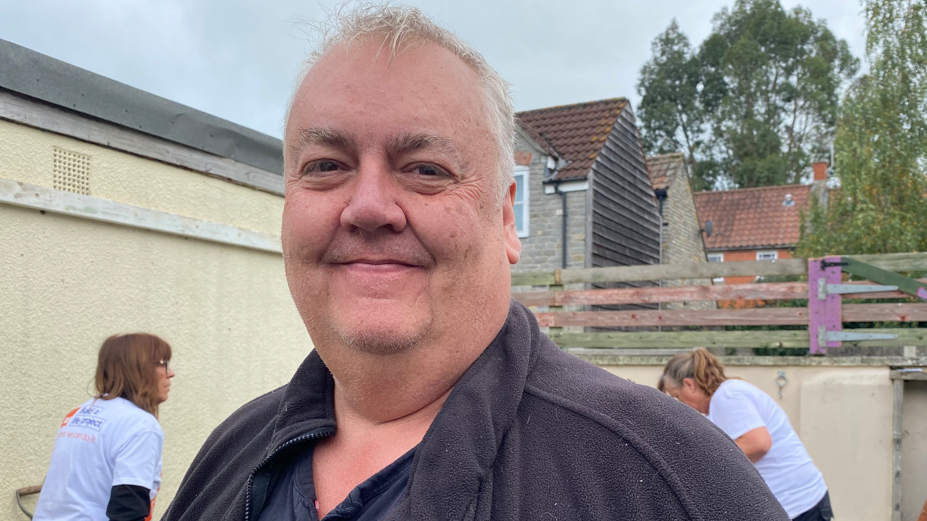 The founder of the project, Scott McMillan, standing on the land next to the United Reformed Church in Glastonbury.