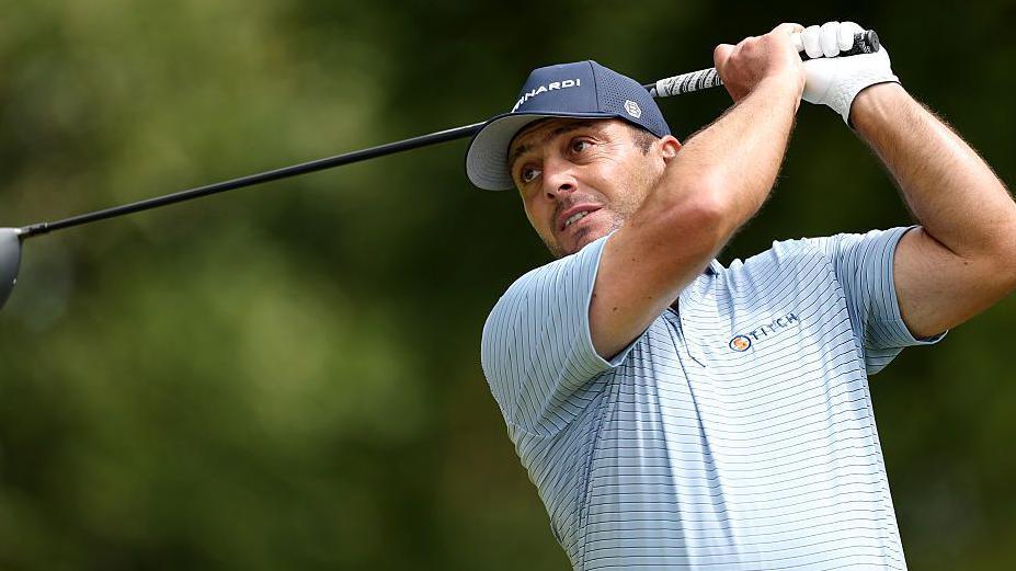 Golfer Francesco Molinari plays a shot at the Scottish Open