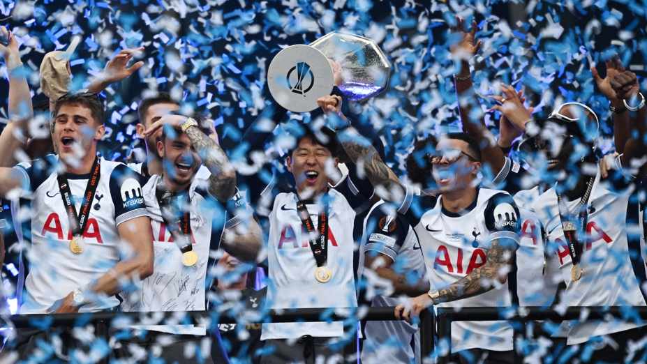 Tottenham Son Heung-min lifts the trophy during the Europa League victory parade following the win over Manchester United in the final