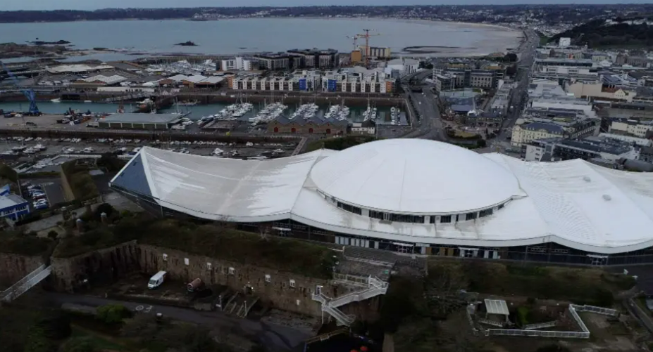 Drone image of Fort Regent and the St Helier skyline, including views of St Aubin's Bay
