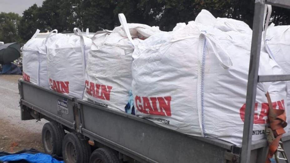 A truck with lots of bags filled with sleeping bags