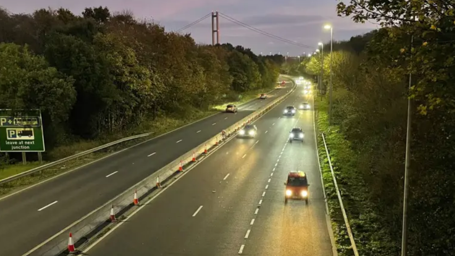 Cars travelling down both carriageways on the A63 in the dark.