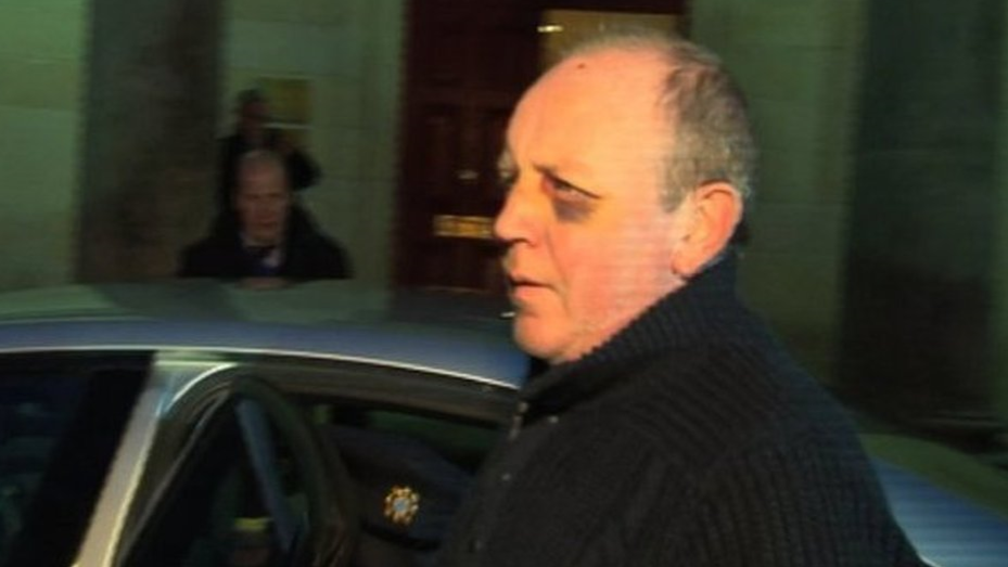 Shows Pearse McAuley with a black eye after being arrested for stabbing his estranged wife