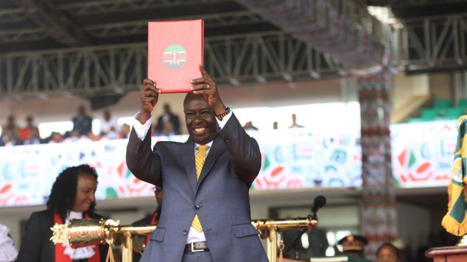 Deputy president of Kenya Rigathi Gachagua holds a certificate during the swearing in ceremony at the Kasarani Stadium