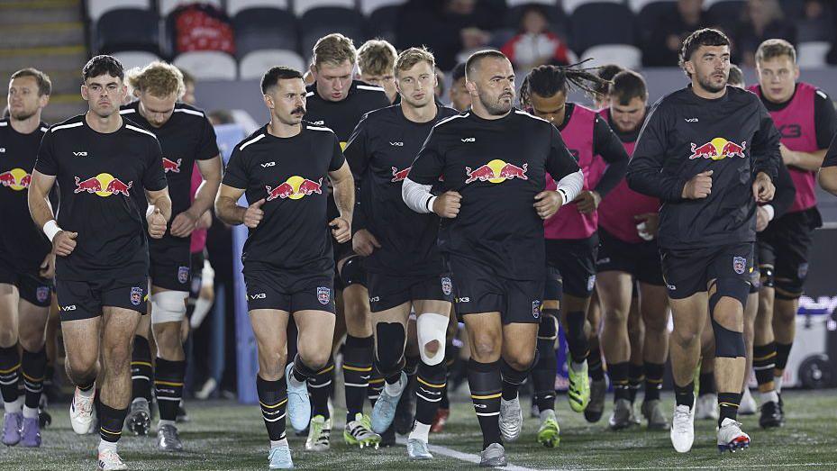 Newcastle Red Bulls players warming up before the Saracens game