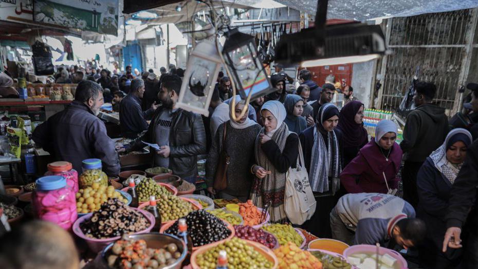 Palestinians shop in the old Zawiya market on the second day of the holy month of Ramadan, in Gaza City, on Sunday, 2 March 2025.