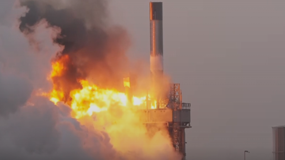 rocket explosion, flames and smoke bellowing from the launch pad below the rocket