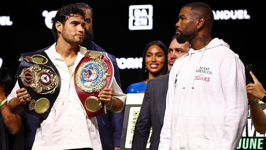 Gilberto Ramirez and Yuniel Dorticos stare at each other during a face off