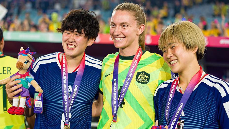Clare Hunt, Maika Hamano and Toko Koga poses for a picture