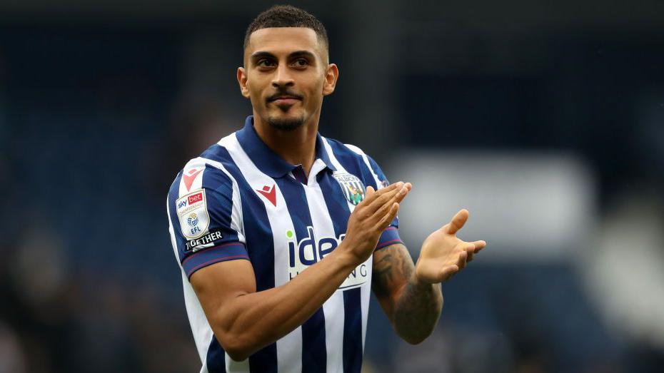 Karlan Grant claps the fans at the end of a game for West Brom