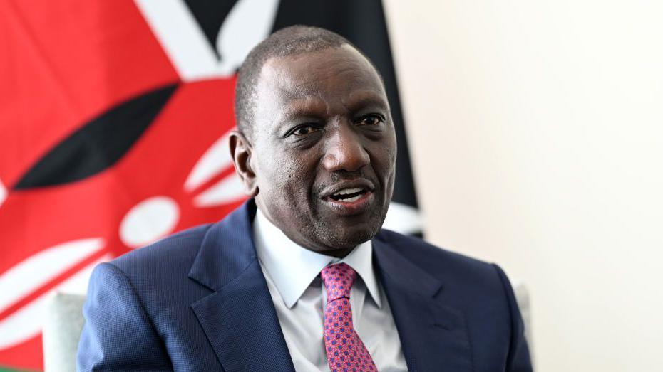 President of Kenya William Ruto talks with British Prime Minister Keir Starmer during a Bi-Lateral meeting at United Nations on September 25, 2024 in New York, New York. He is wearing a dark blue jacket and a pink and blue tie with a white shirt.