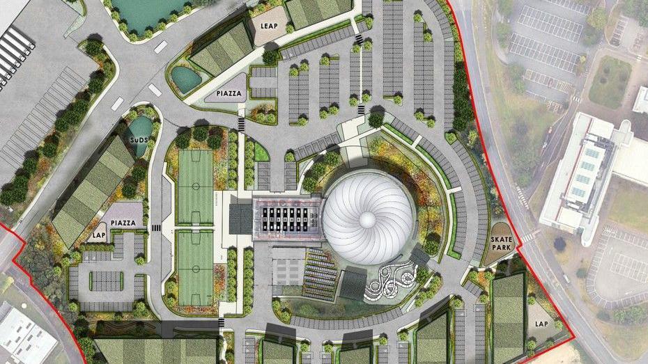 Aerial view of the proposed centre showing the iconic dome as well as two outdoor tennis courts and parking facilities 