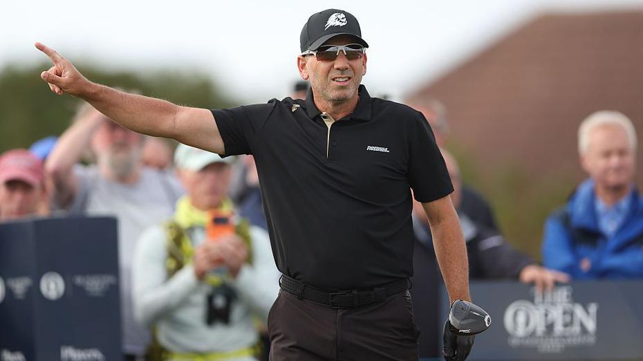 Sergio Garcia holding a driver and pointing