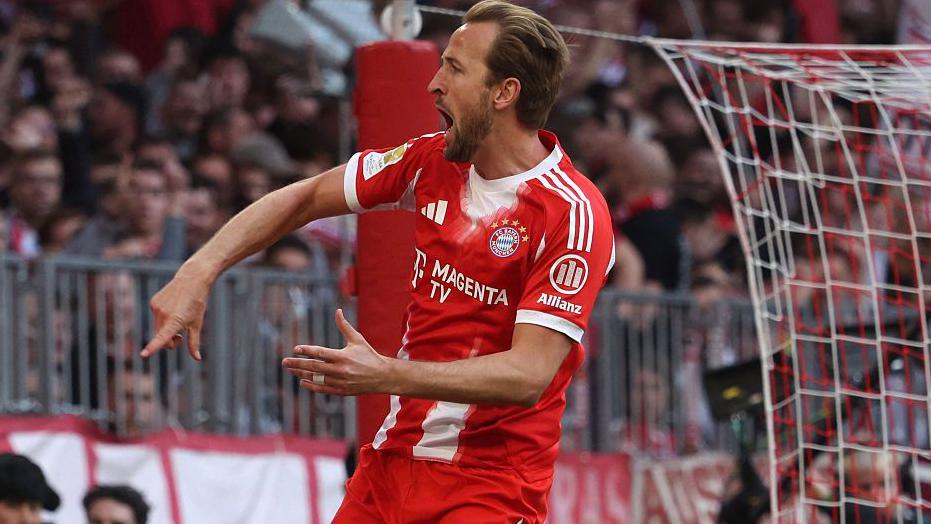 Harry Kane celebrates scoring against Stuttgart