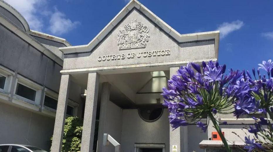 Truro Crown Court doorway and building with flowers in forefront