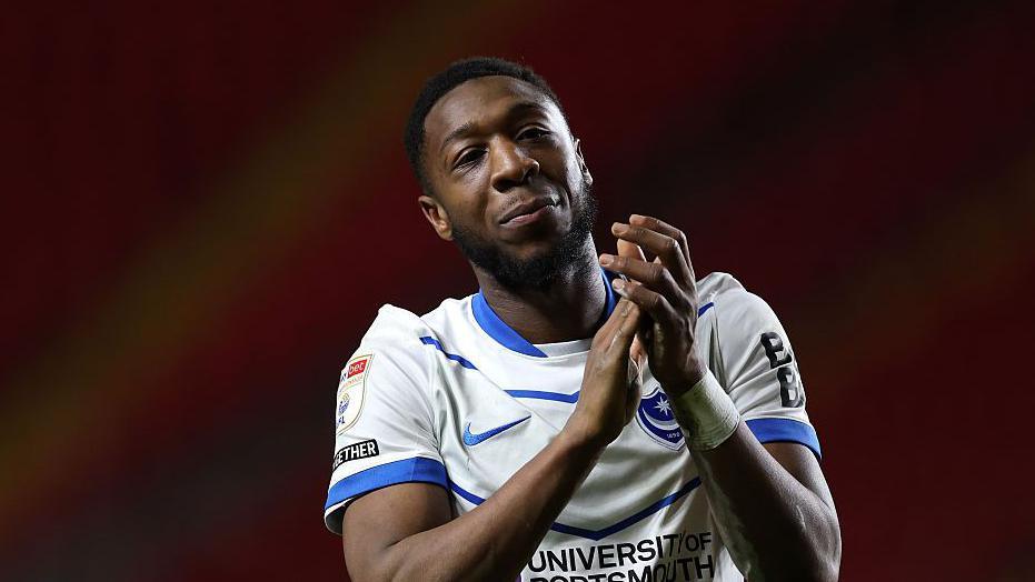 Ebou Adams applauds the Portsmouth fans after the game against Charlton Athletic