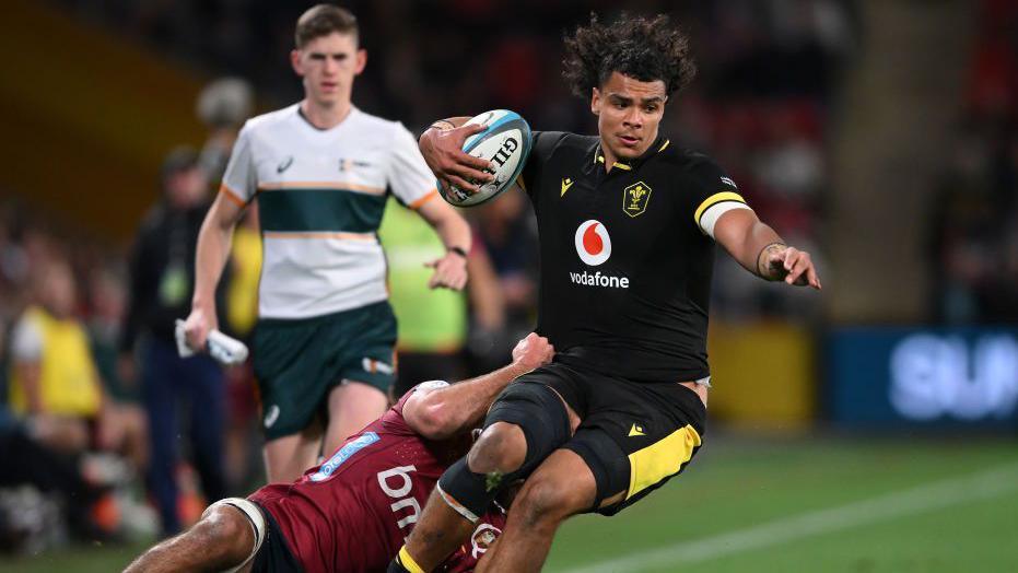 Mackenzie Martin is tackled against Queensland Reds