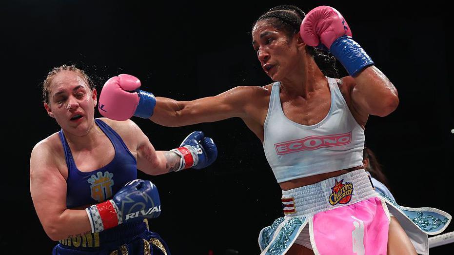 Amando Serrano punches Reina Tellez