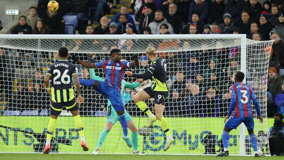 Erling Haaland jumps to head Manchester City's first goal against Crystal Palace in December