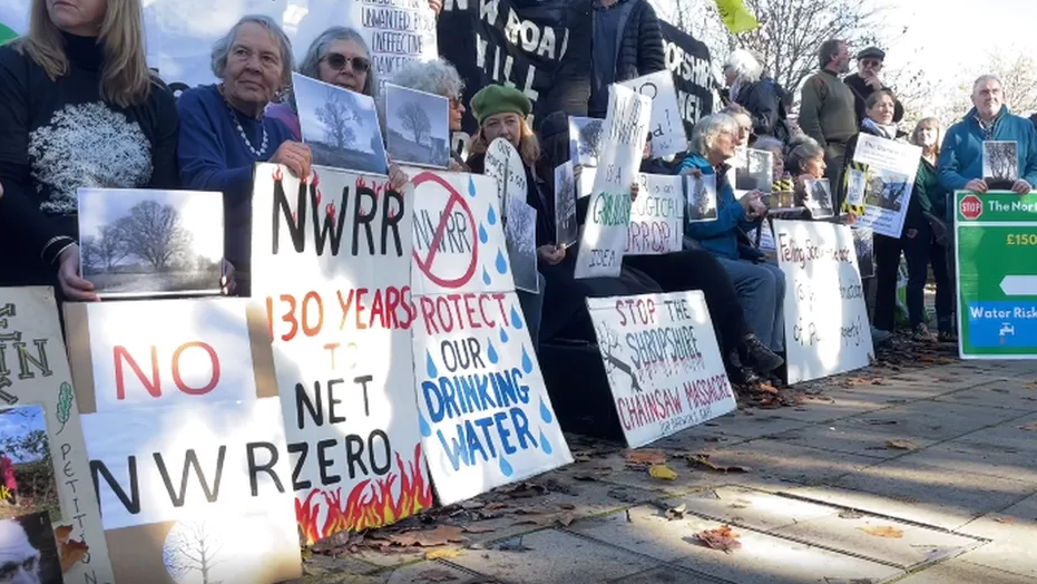 Protestors holding placards outside Shirehall, Shrewsbury