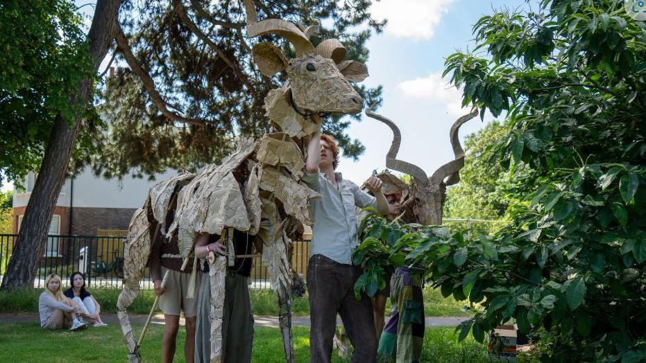 UAL students with the puppets 