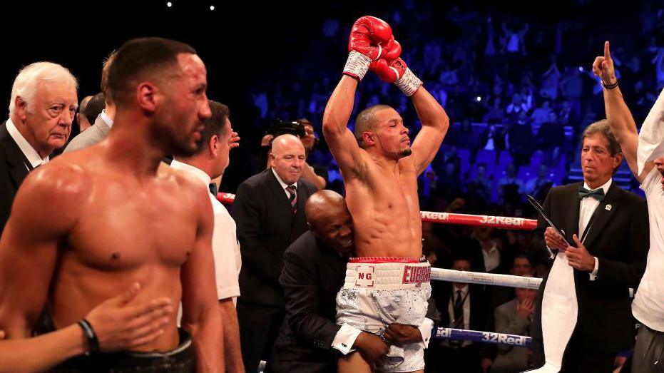 James DeGale is consoled as Chris Eubank Jr celebrates being declared the winner