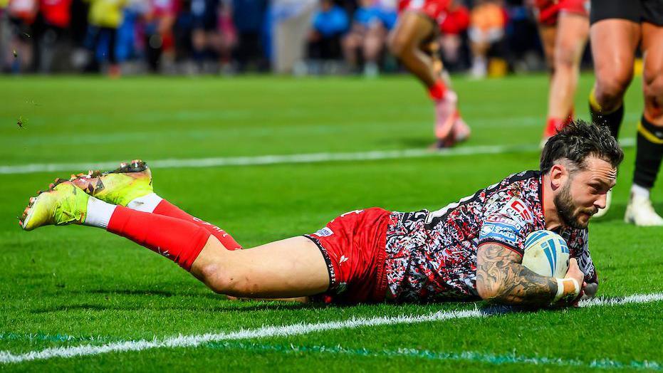 Gareth O'Brien crashes down with the ball to score a try for Leigh at the York Community Stadium