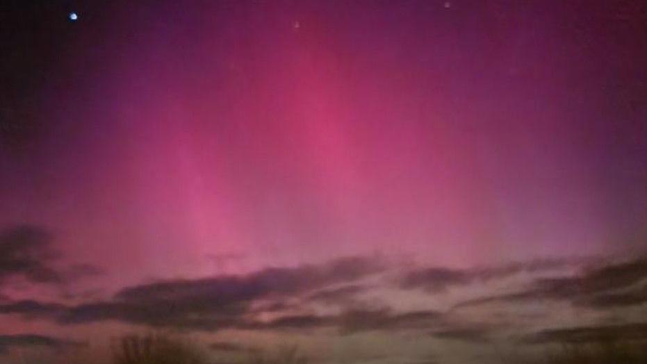 A purple sky with pink lights.