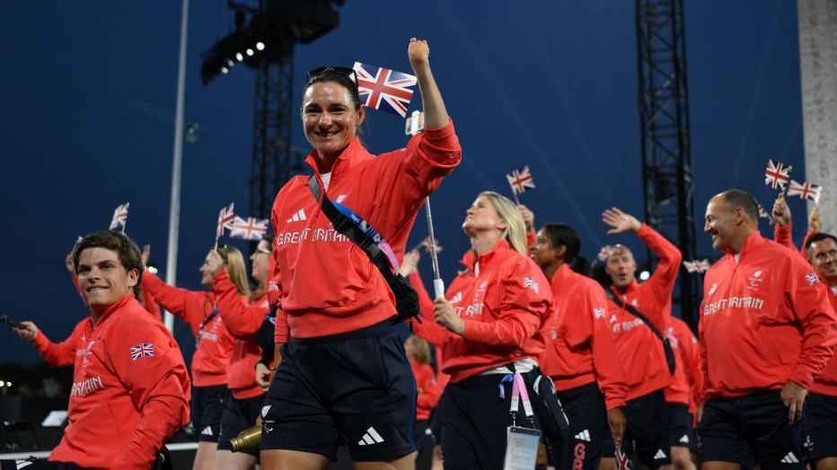 Athletes of Team Great Britain hold their national flag as they parade during the opening ceremony of the Paris 2024 Summer Paralympic Games