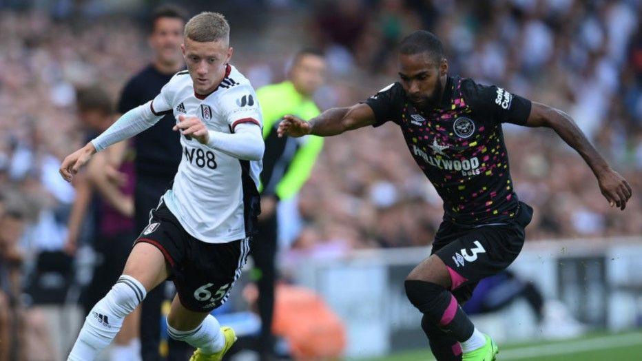 Jay Stansfield vies for the ball with Brentford's Rico Henry