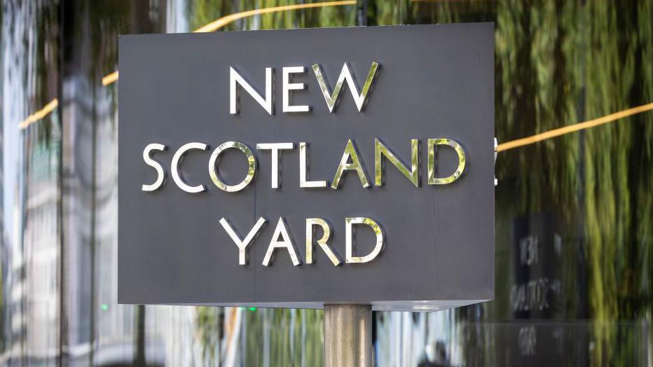 File image showing the grey and silver New Scotland Yard sign