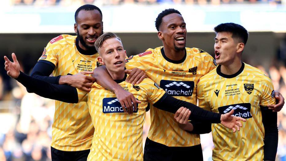 Maidstone players celebrate after Sam Corne's goal