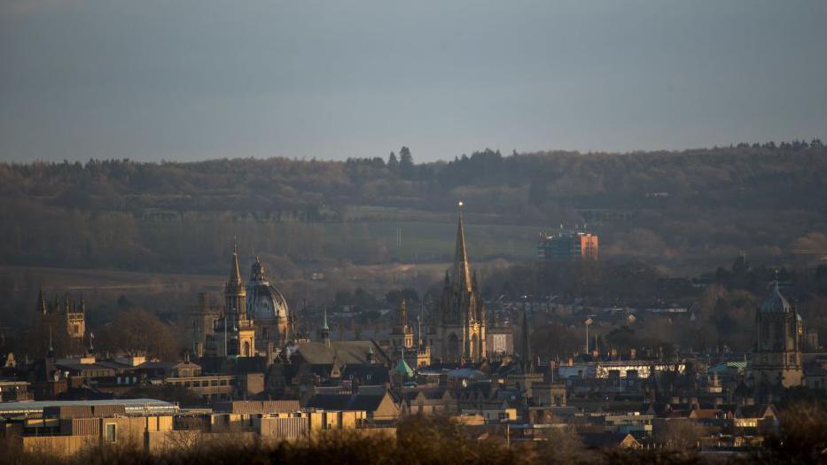 Spires and rooftops of buildings in Oxford.