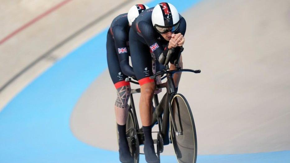 Cyclists Steve Bate and pilot Chris Latham in the National Velodrome during the Paris Summer Paralympic Games in 2024