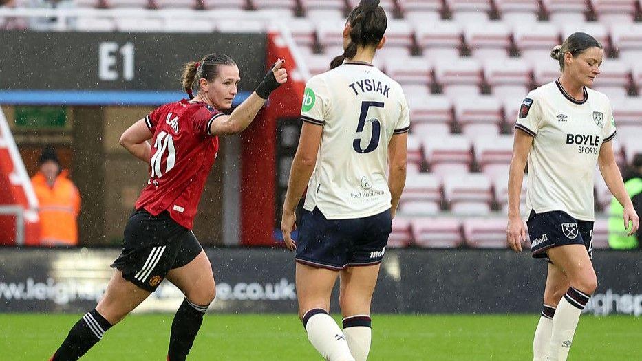 Elisabeth Terland celebrates after scoring the opening goal for Manchester United