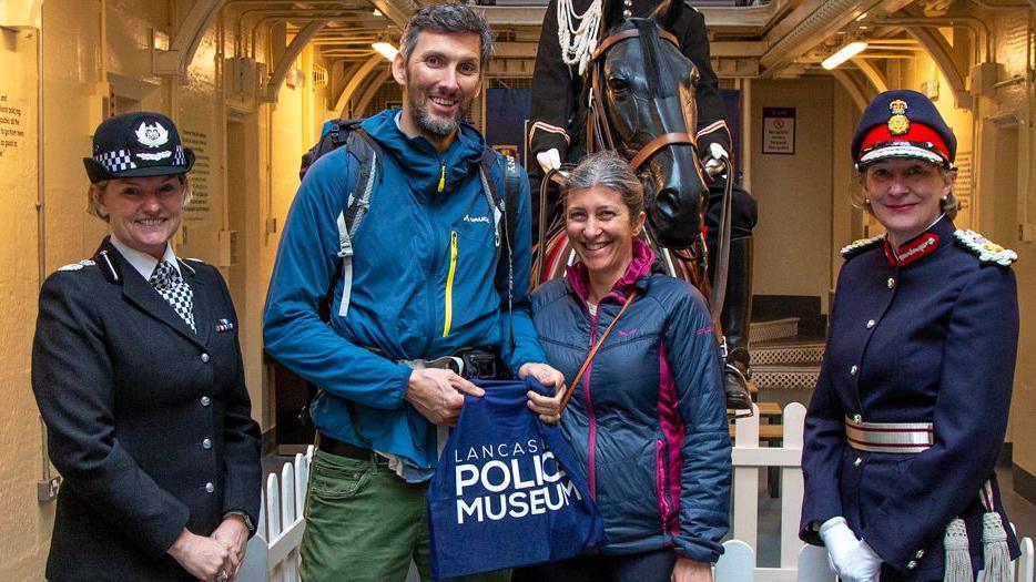 Michel Alberio from Switzerland received a bag of souvenirs from Lancashire's Chief Constable (left) 