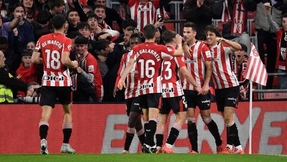 Athletic Bilbao players celebrate scoring a goal against Real Madrid