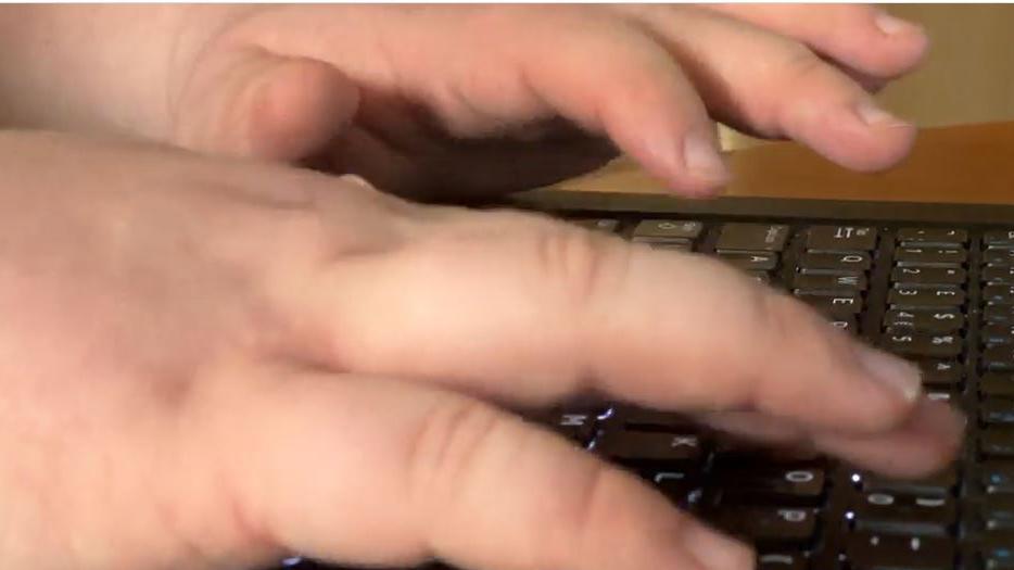 Hands typing on a keyboard