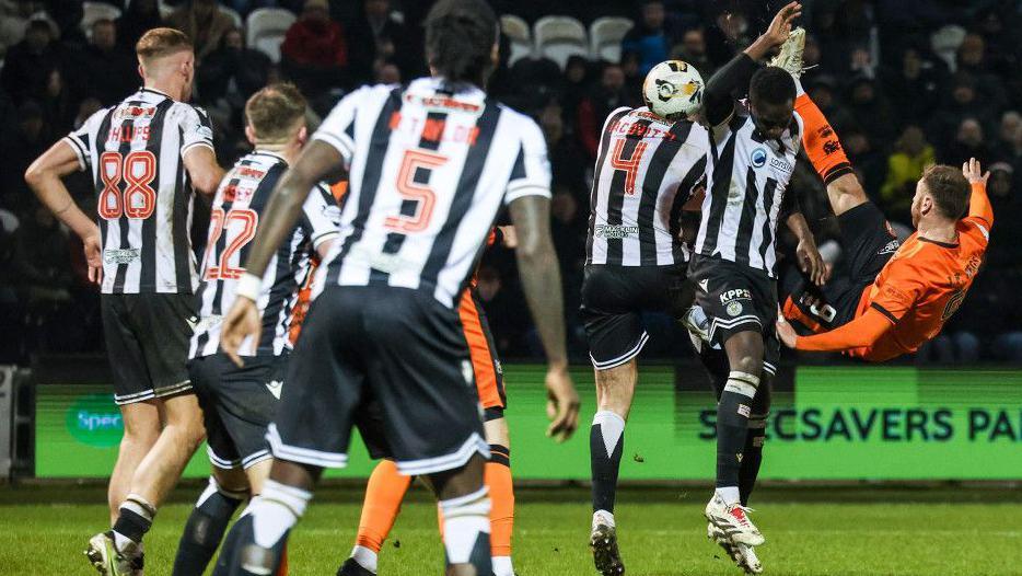 Dundee United's Louis Moult (right) scores the winner against St Mirren