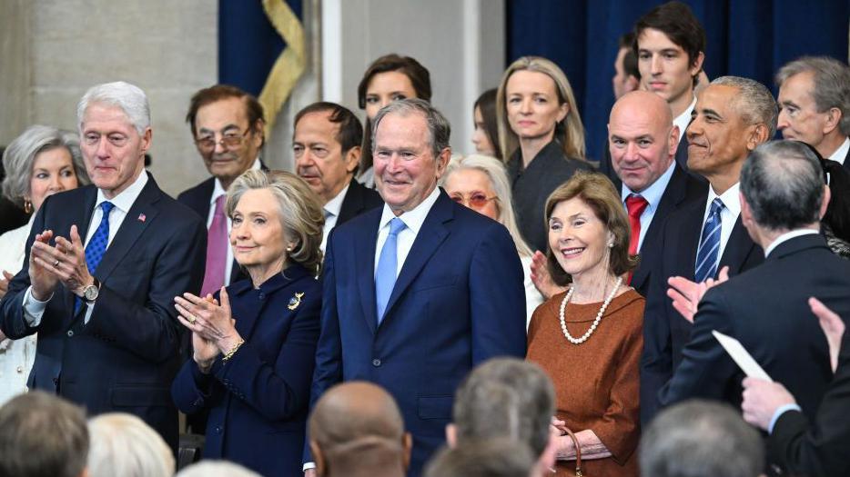 Former US President Bill Clinton, from left, Hillary Clinton, former US secretary of state, Former US President George W Bush, former US First Lady Laura Bush, and former US President Barack Obama arrive for the 60th presidential inauguration in Emancipation Hall of the US Capitol