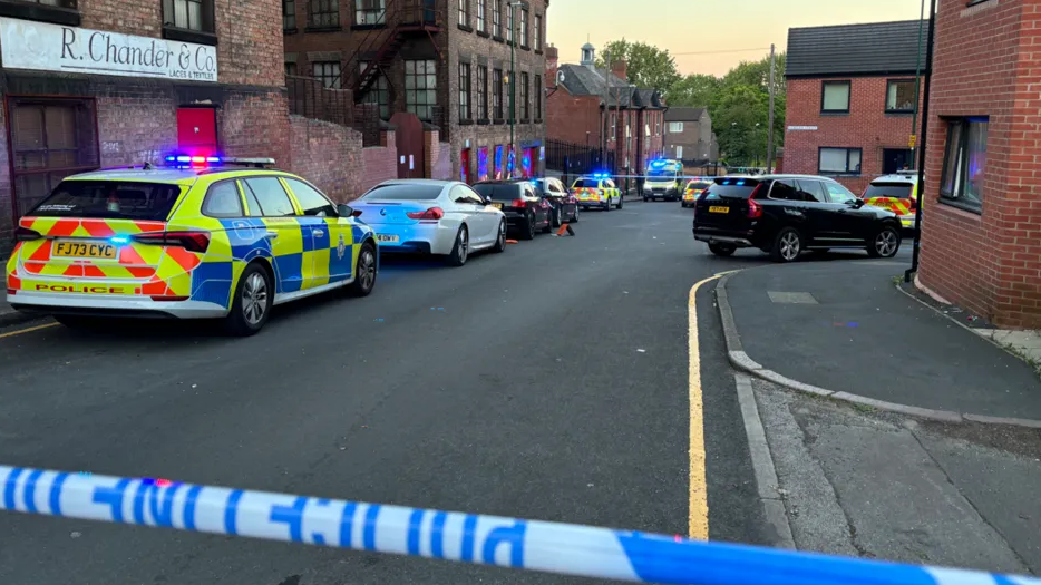 Police cars and paramedics inside a police cordon in Alfred Street North