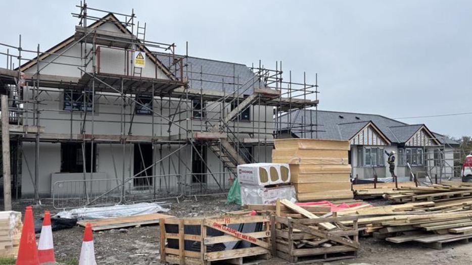 Scaffolding around a house that is being built