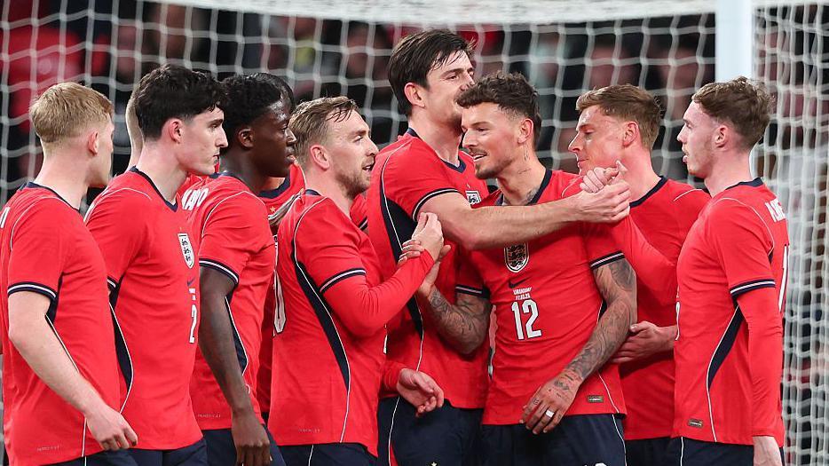 Ben White is congratulated by his England team-mates after opening the scoring in the friendly against Uruguay at Wembley.