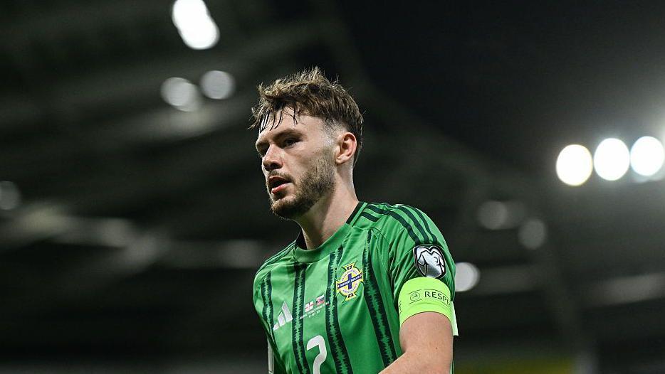 Conor Bradley in the Northern Ireland kit with the captain's armband