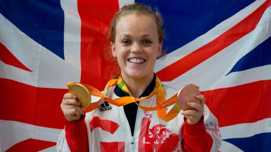 Ellie Simmonds celebrates with her medals