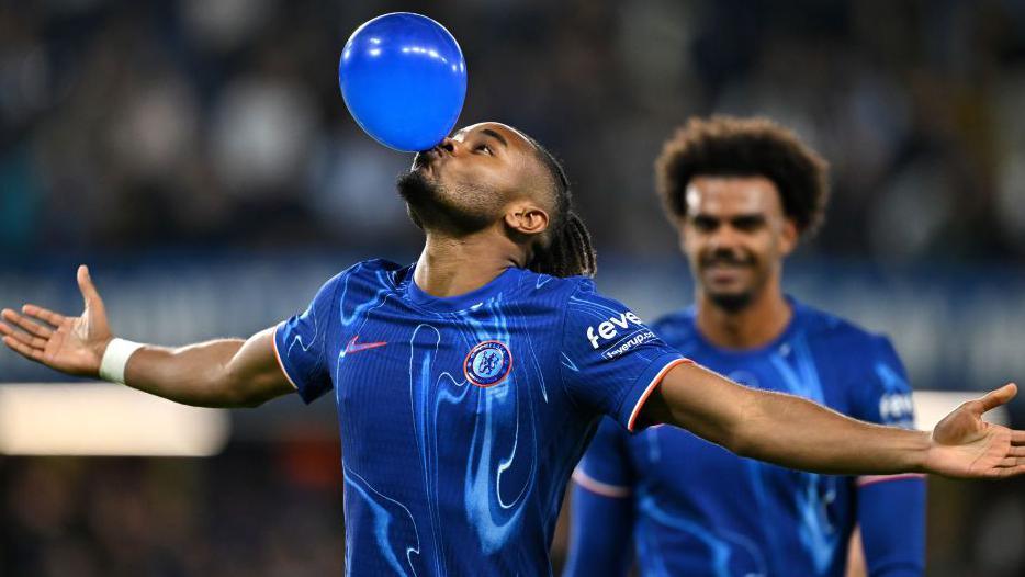 Christopher Nkunku performing his iconic balloon celebration against Barrow at Stamford Bridge