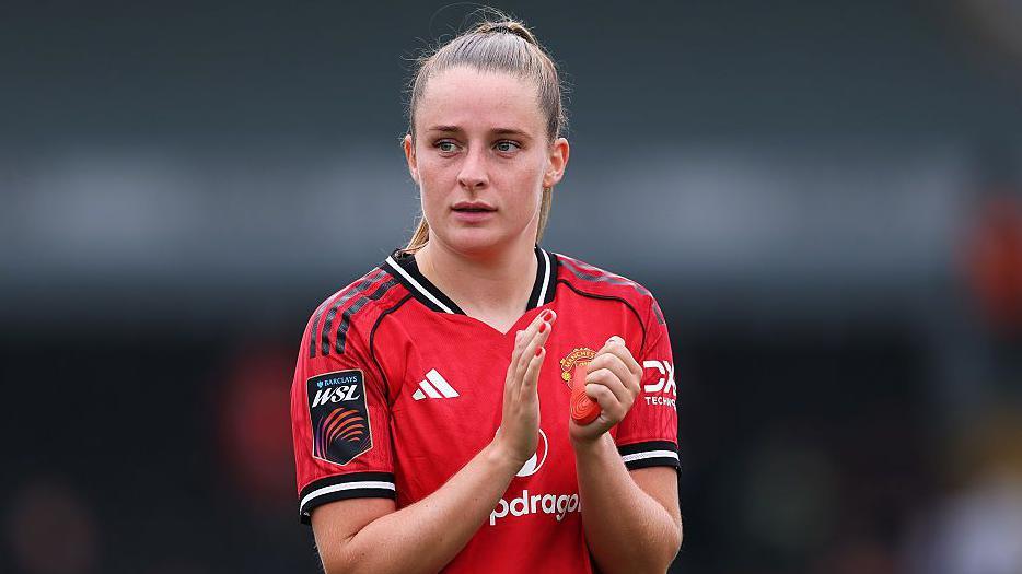 Ella Toone of Manchester United applauds the fans after the team's victory during the Barclays Women's Super League match between London City Lionesses and Manchester United